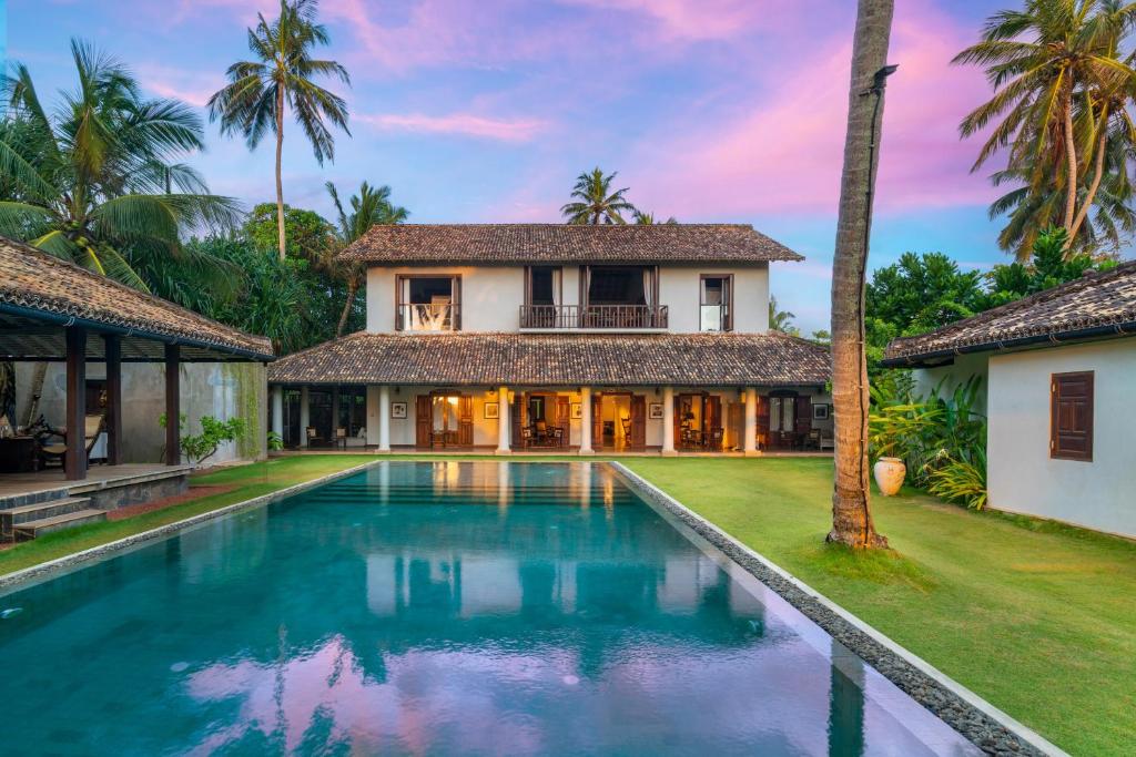 Resort Building at Dusk — Colonial Facade & Pool