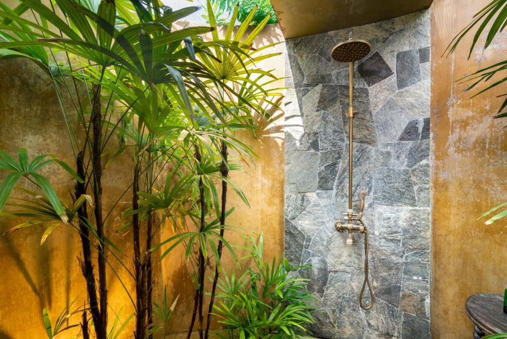 Outdoor Shower — Stone Wall & Bronze Rain Fixture