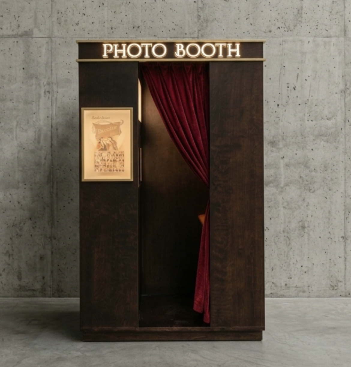 Custom Accomplice photo booth with marquee sign and velvet curtain