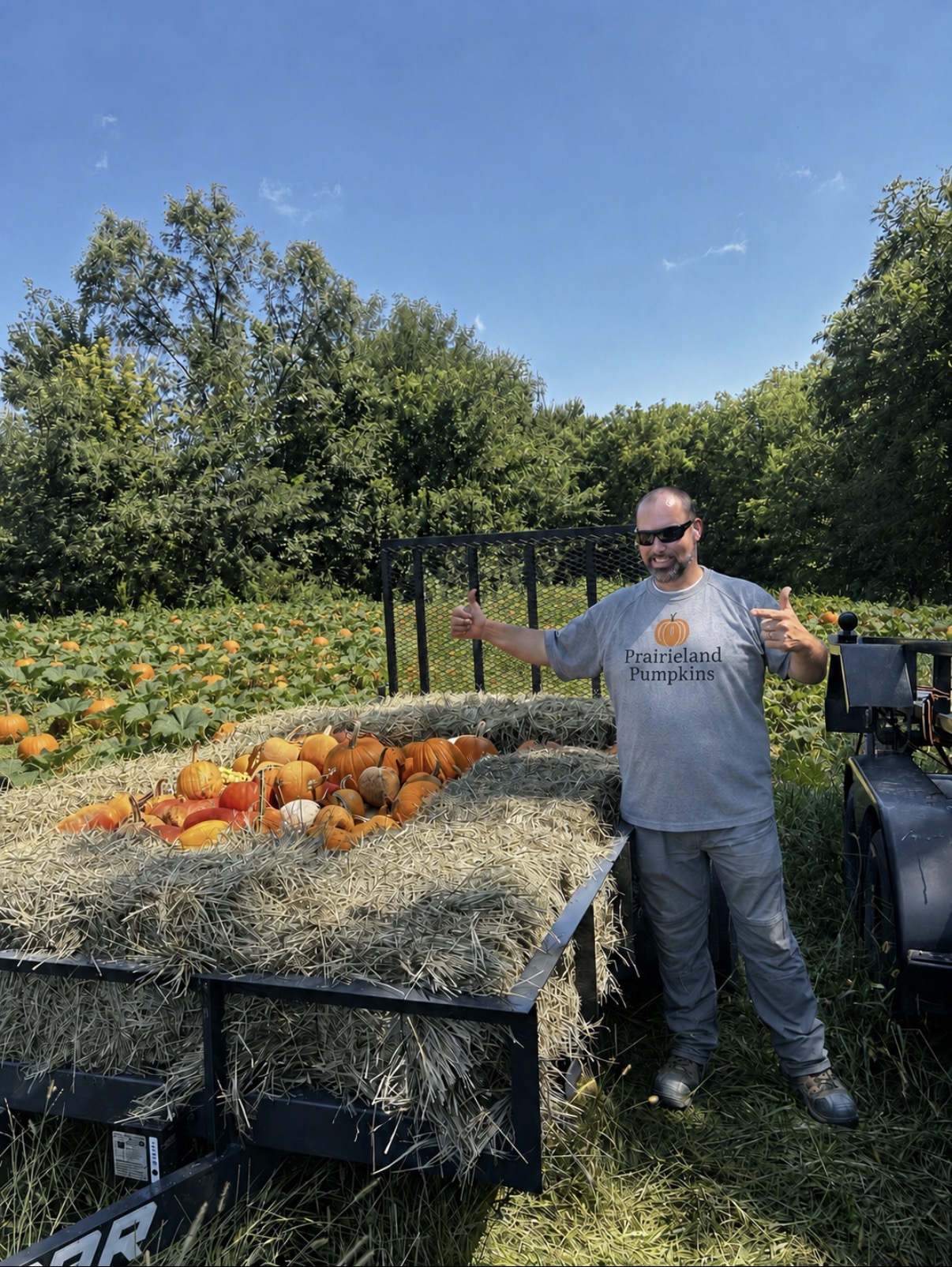 Prairieland Pumpkins team with a trailer full of carving pumpkins