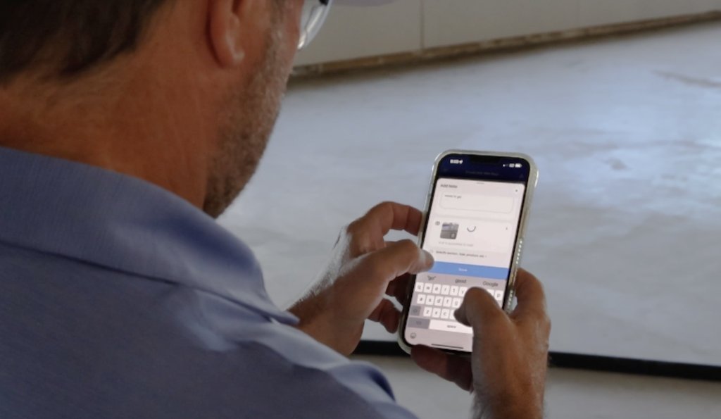 Contractor checking app on jobsite