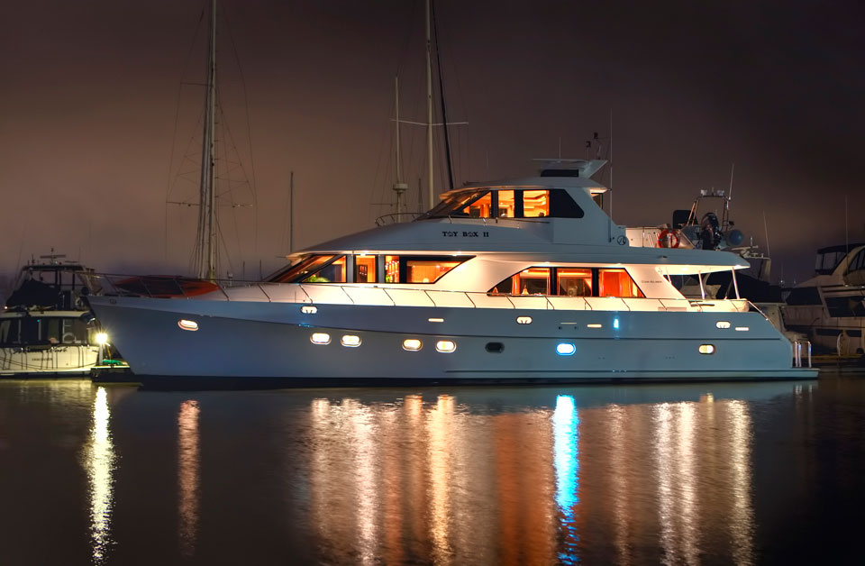TOYBOX II illuminated at night at her dock