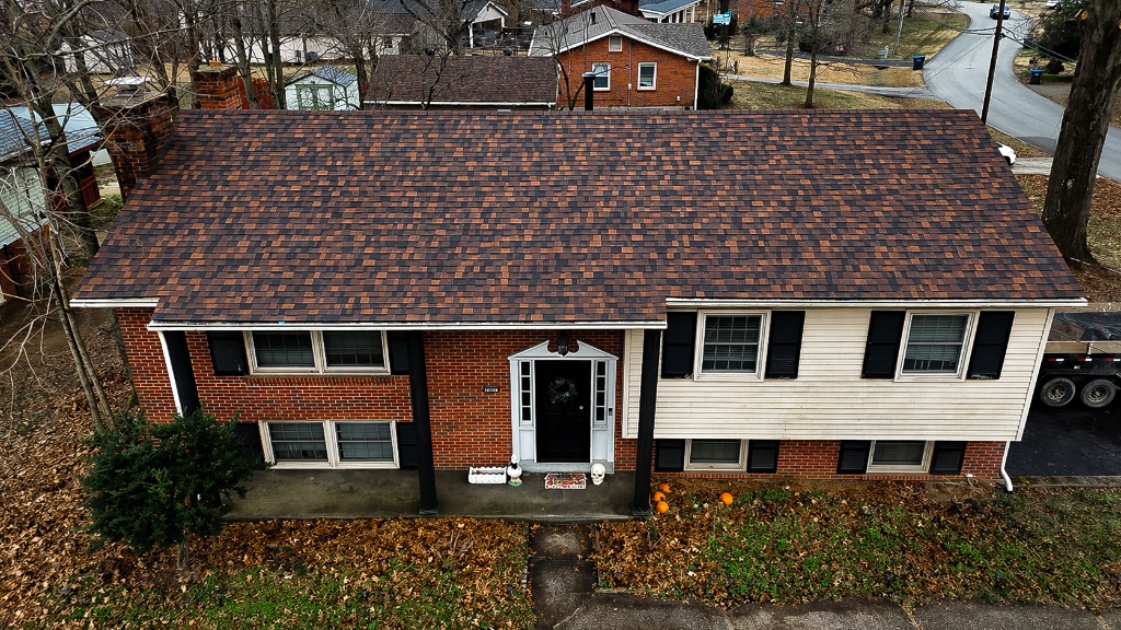 Completed roof replacement with new dark charcoal architectural shingles