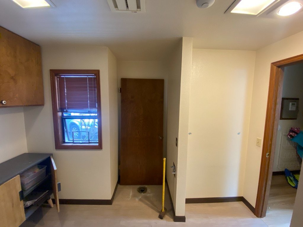 Before — right side of room with original window before conversion