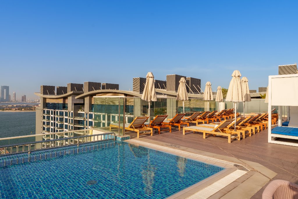 Rooftop pool sun loungers