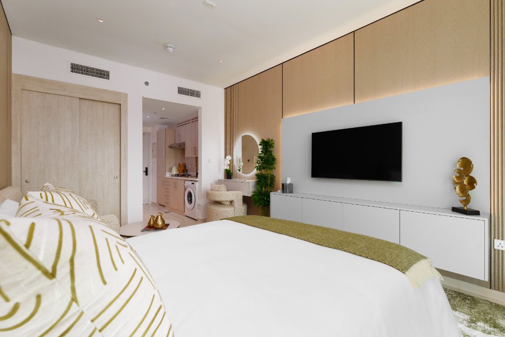 Bed with TV and kitchenette