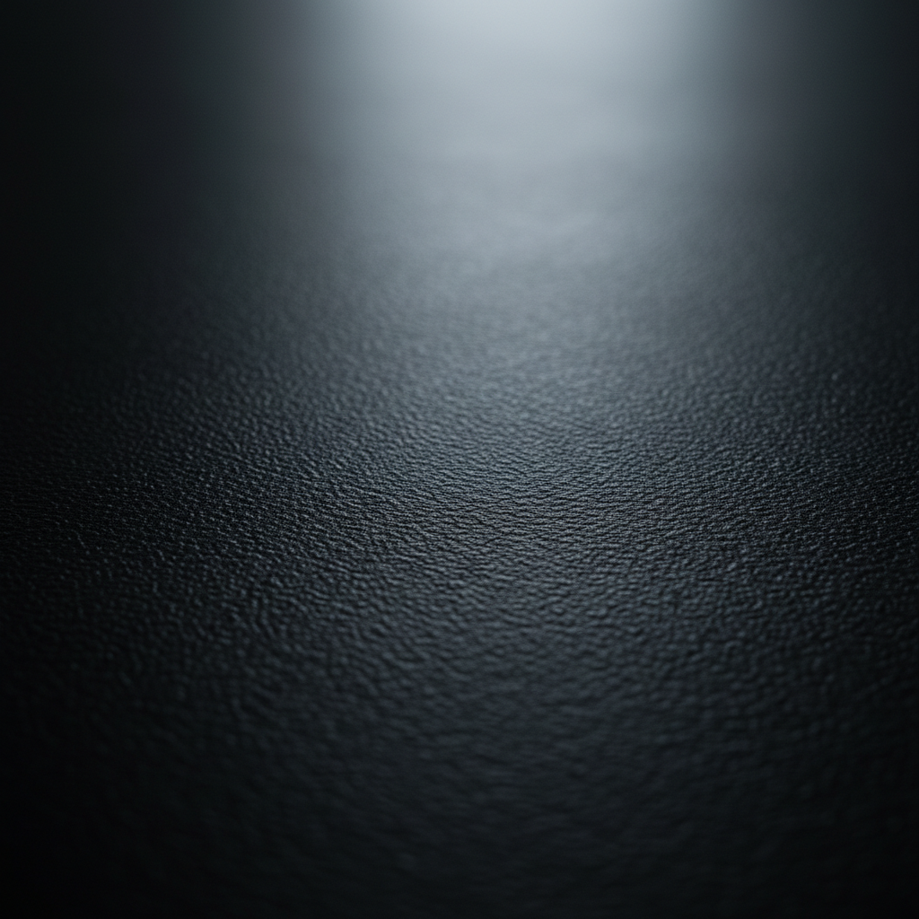Close-up of the black vinyl floor surface showing durable professional-grade texture