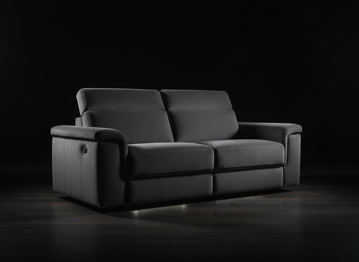 Dark velvet power reclining sofa with dramatic lighting