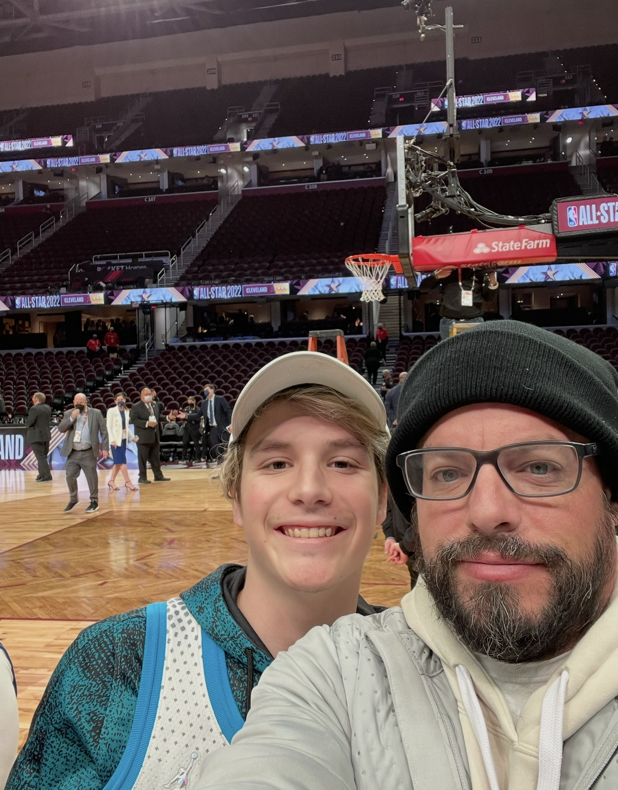 Miles Wallace and a companion taking a selfie on the court at NBA All-Star 2022 in Cleveland.