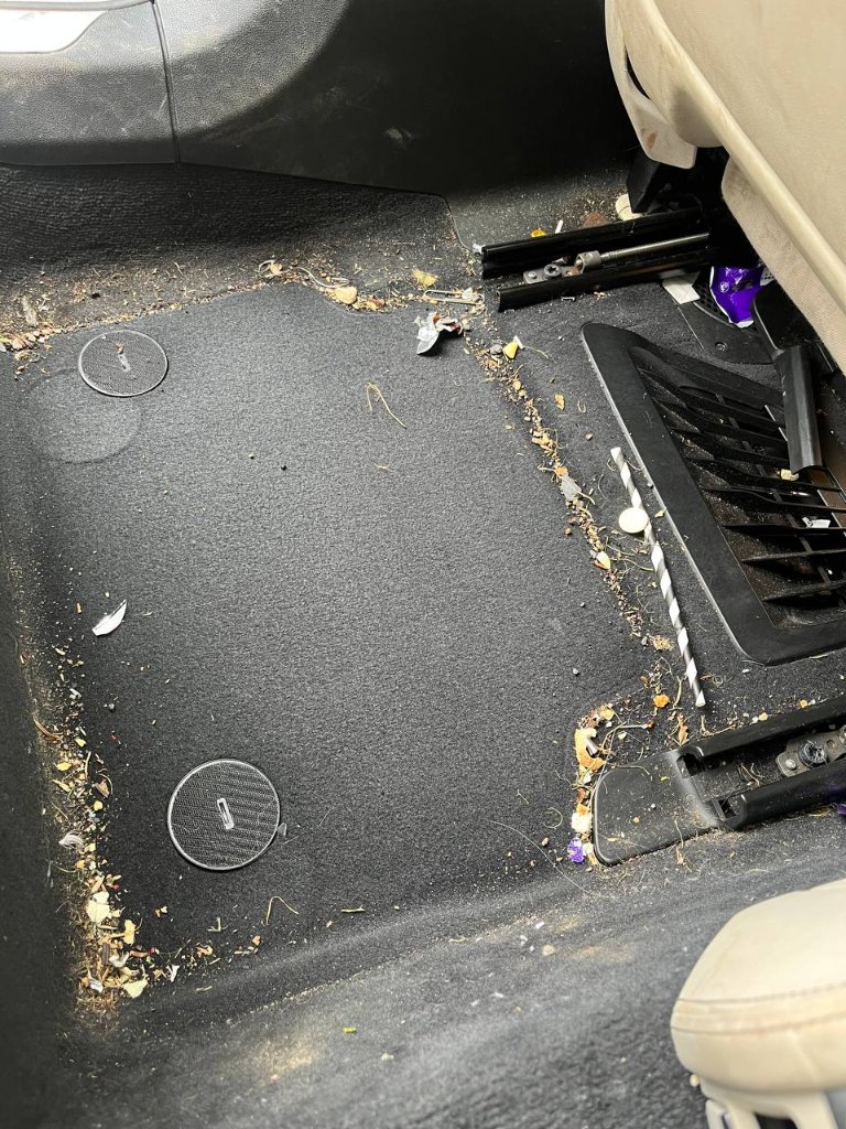 Car rear passenger floor — before mobile detailing in Sligo