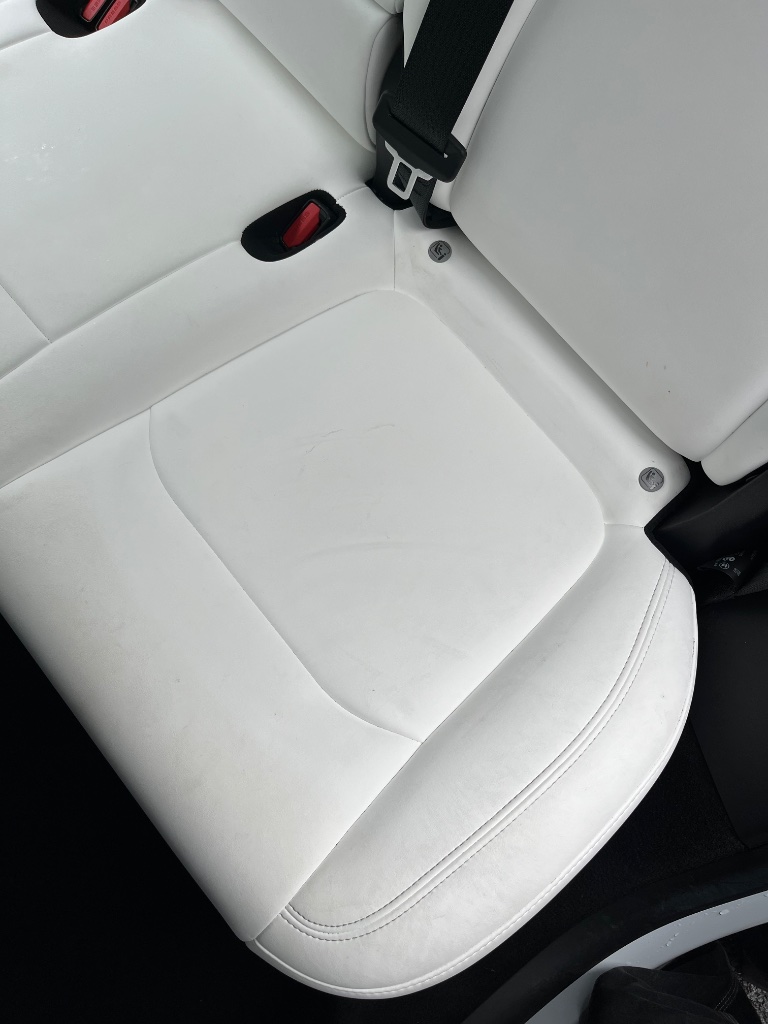 Clean leather car seat after professional detailing by NeatAuto