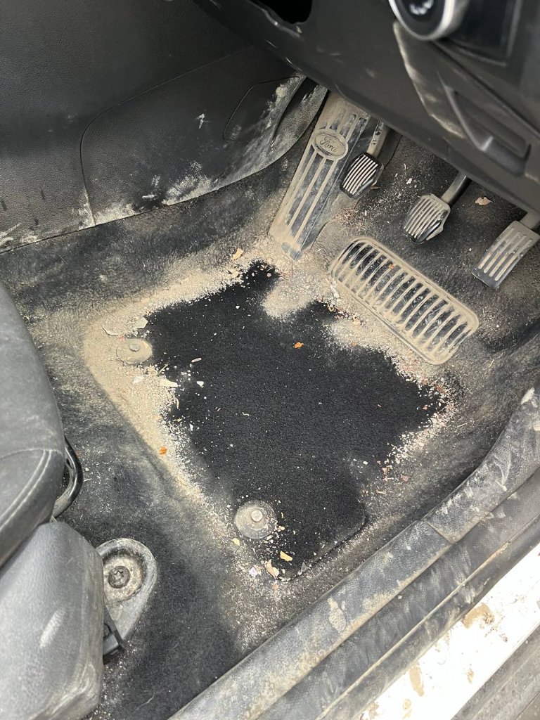 Car interior detailing — driver floor before — mobile valeting in Sligo