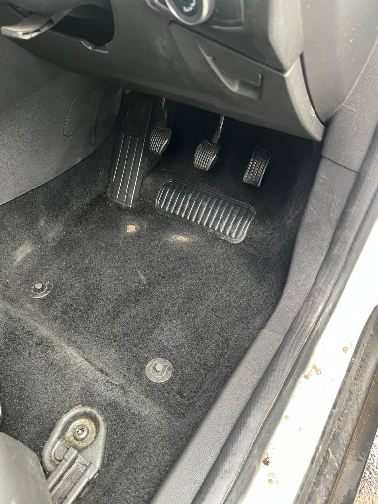 Car interior detailing — driver floor clean result — mobile valeting in Sligo