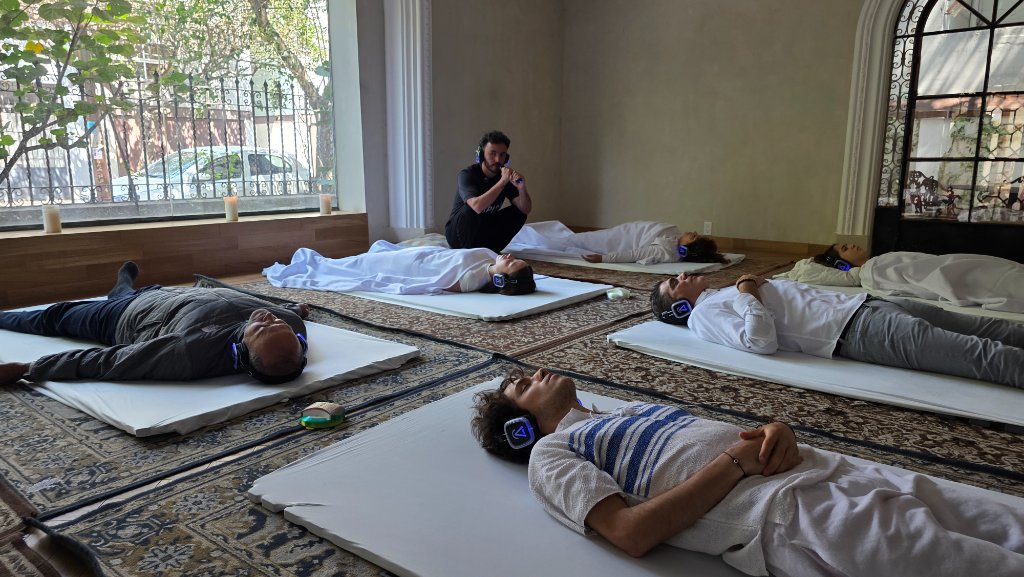 Guided-breathing session with immersive headphones and facilitator