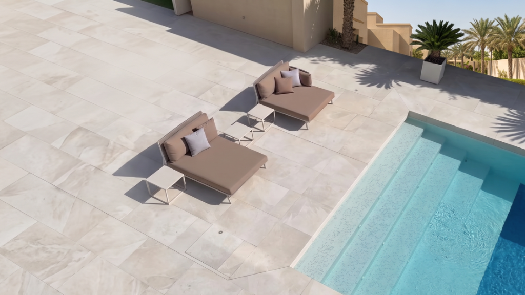 Luxury fiberglass pool with lounge area at a Dubai villa by Bluescape