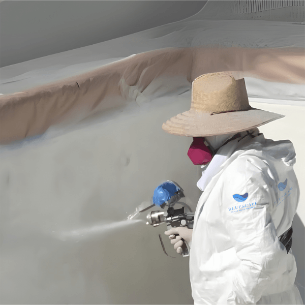 Bluescape technician applying fiberglass coating during beach entry pool construction
