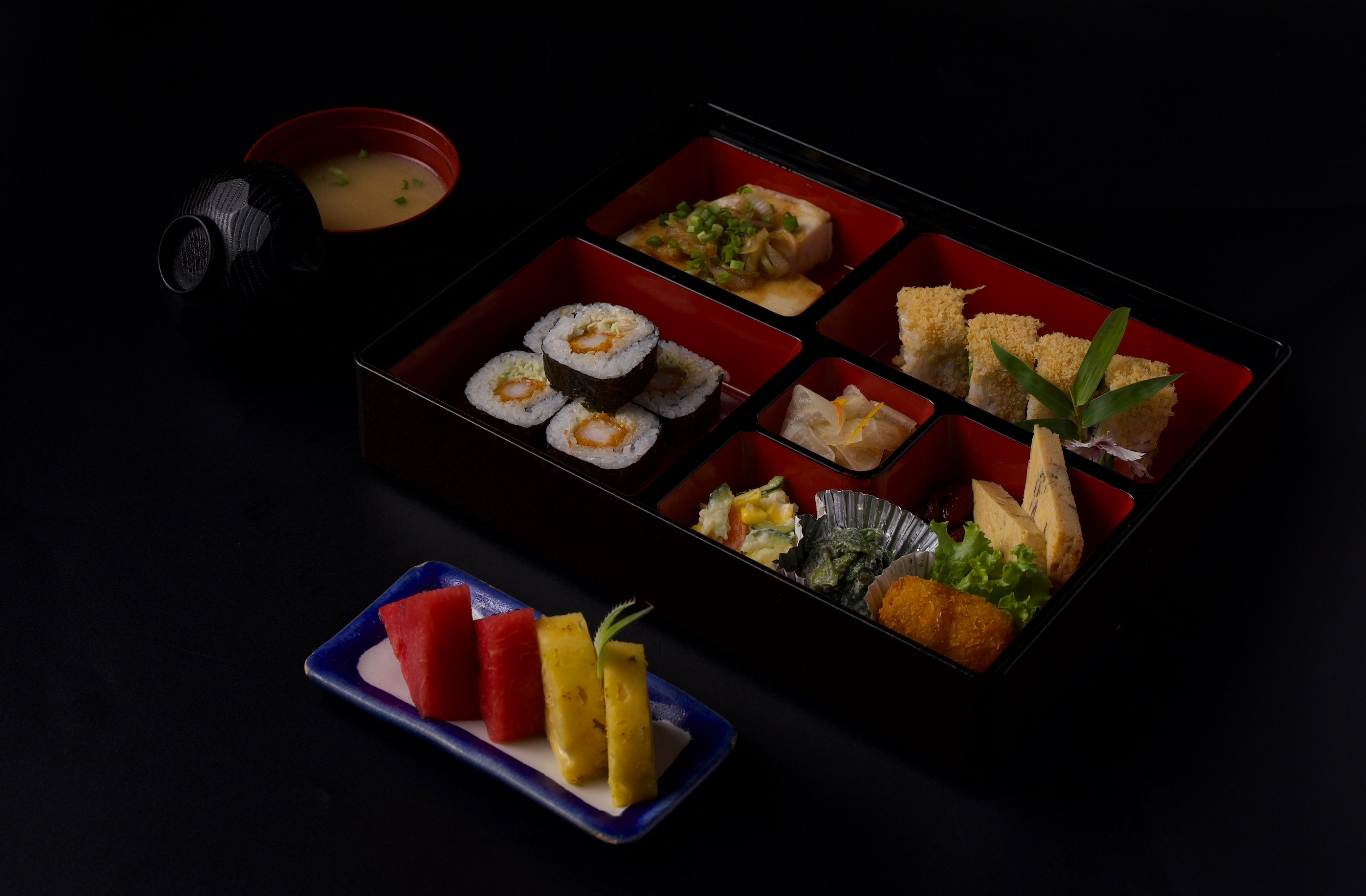 Traditional Japanese bento box at Ginza Hohsen with grilled fish, tempura rolls and miso soup