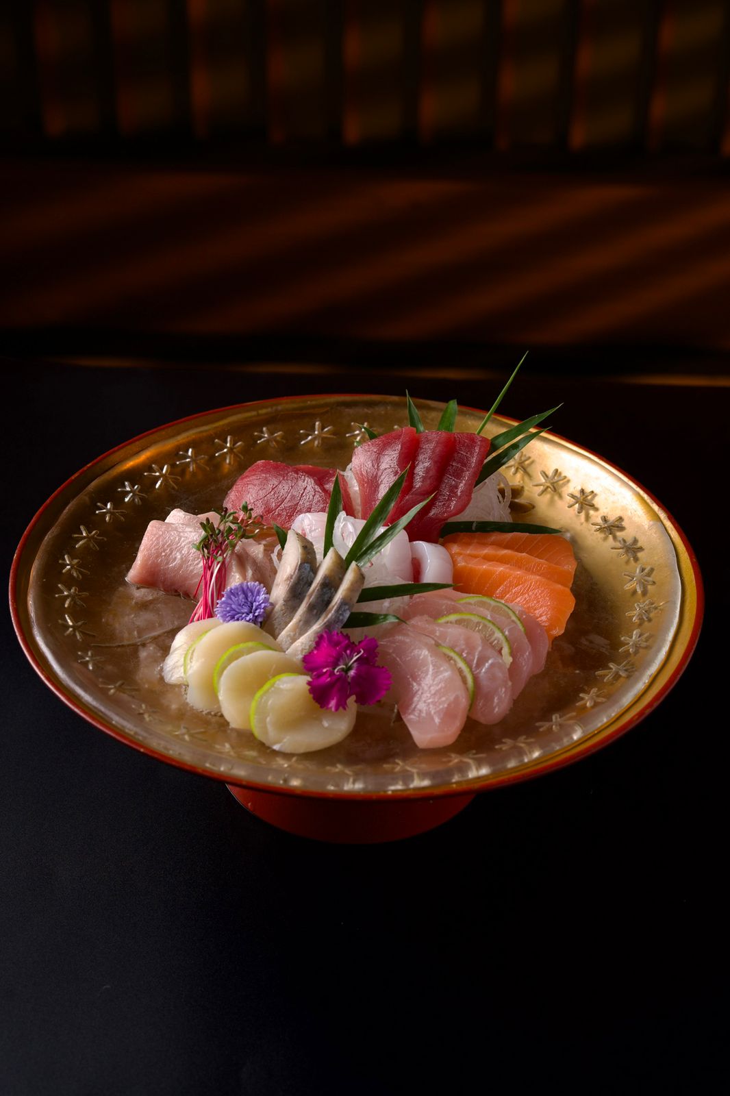 Premium sashimi selection on gold plate at Ginza Hohsen - tuna, salmon and scallop