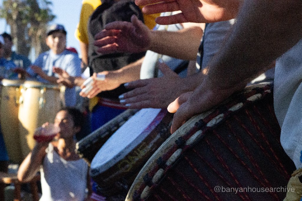 Hands drumming on djembe drums