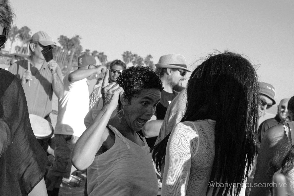 Woman laughing in a crowd