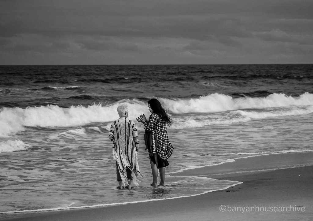 Two women at the ocean shore