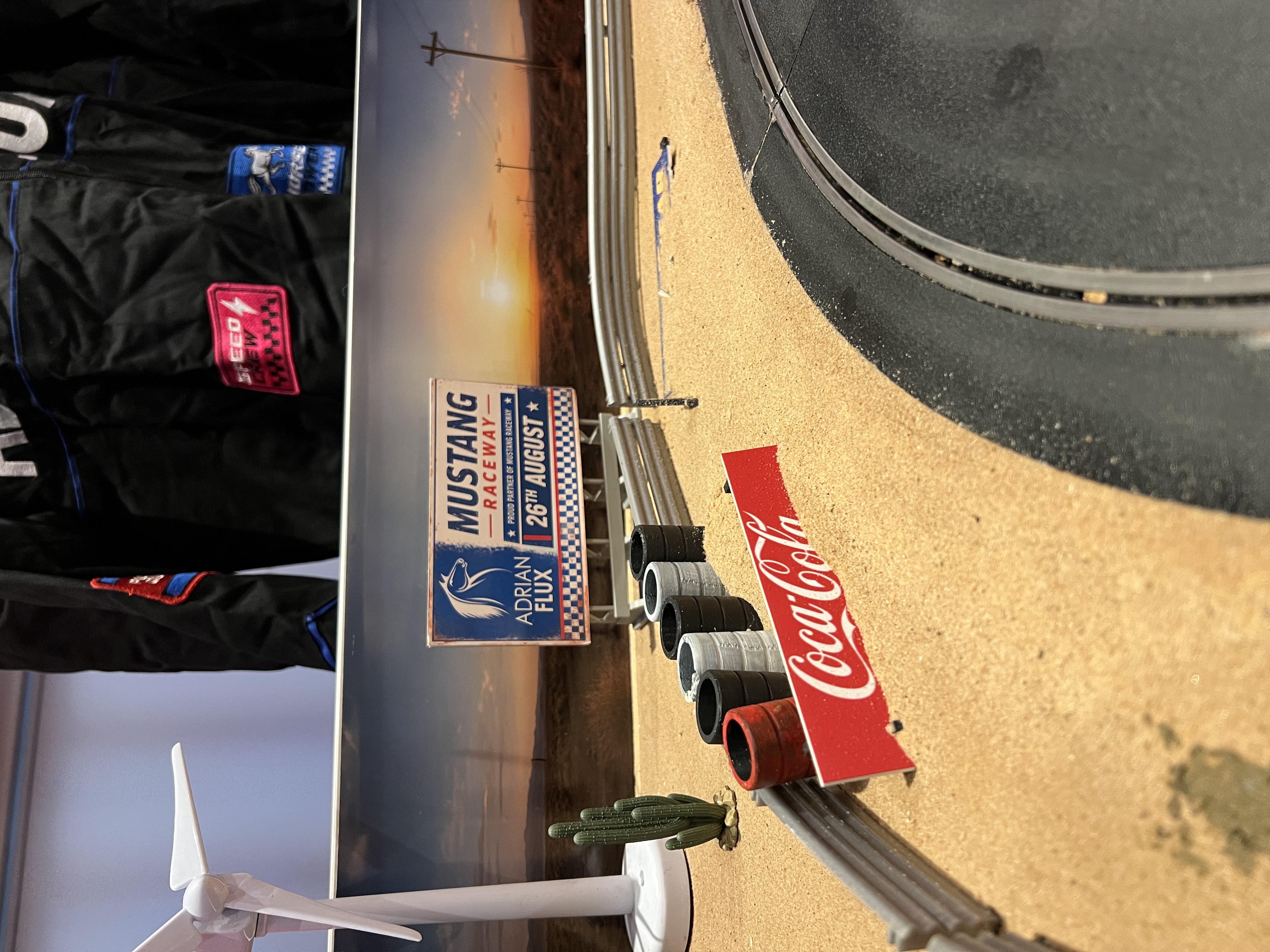 Wide view of the fully branded Adrian Flux Scalextric activation at the Engine Rooms, London