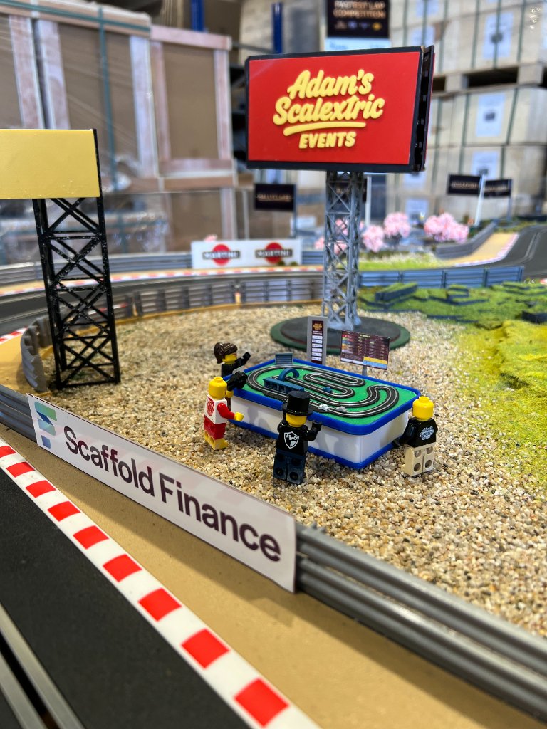 Infield scenery detail with Adam's Scalextric Events branding