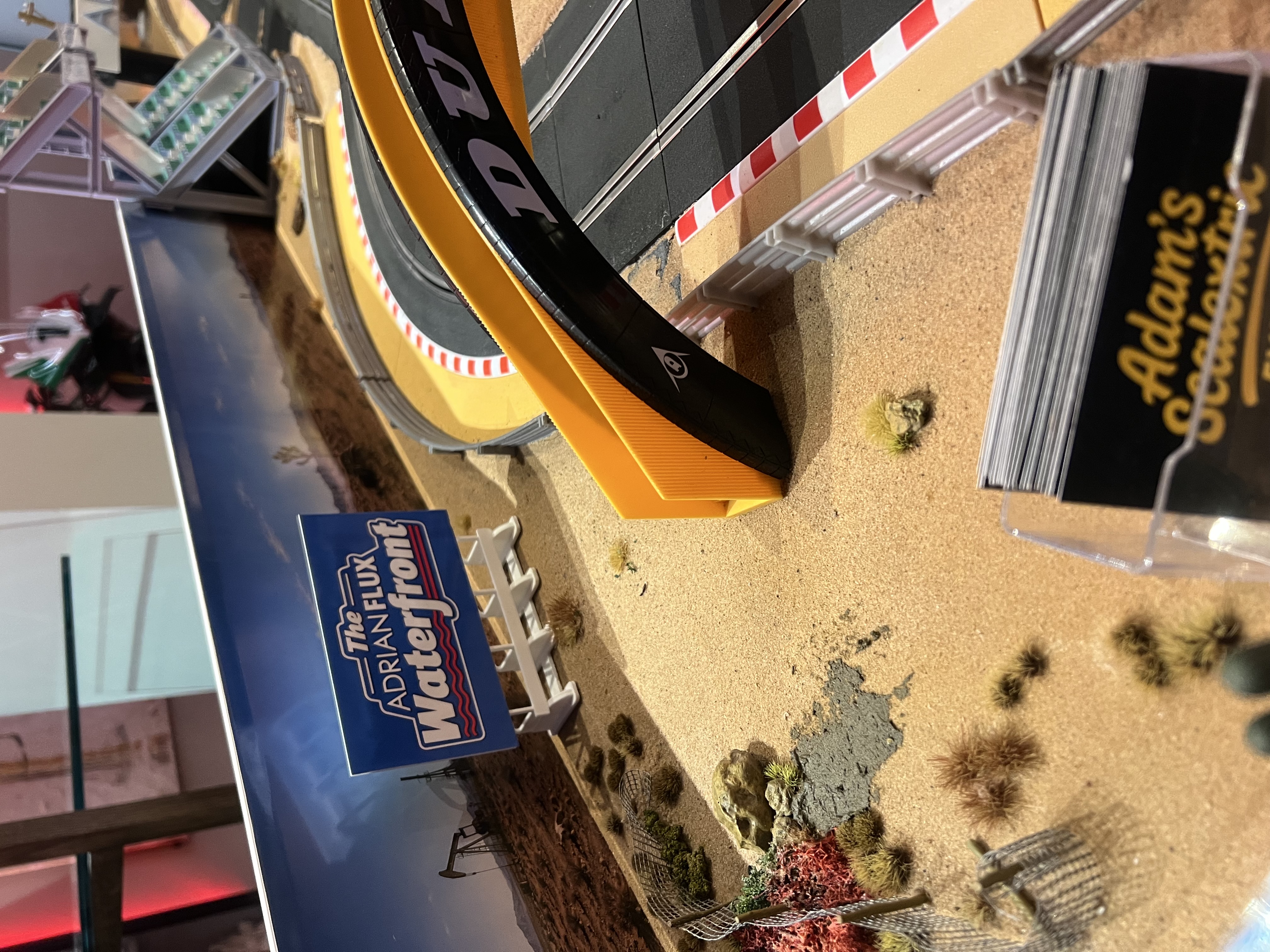 Guests competing in the fastest-lap challenge on the Adrian Flux Scalextric track