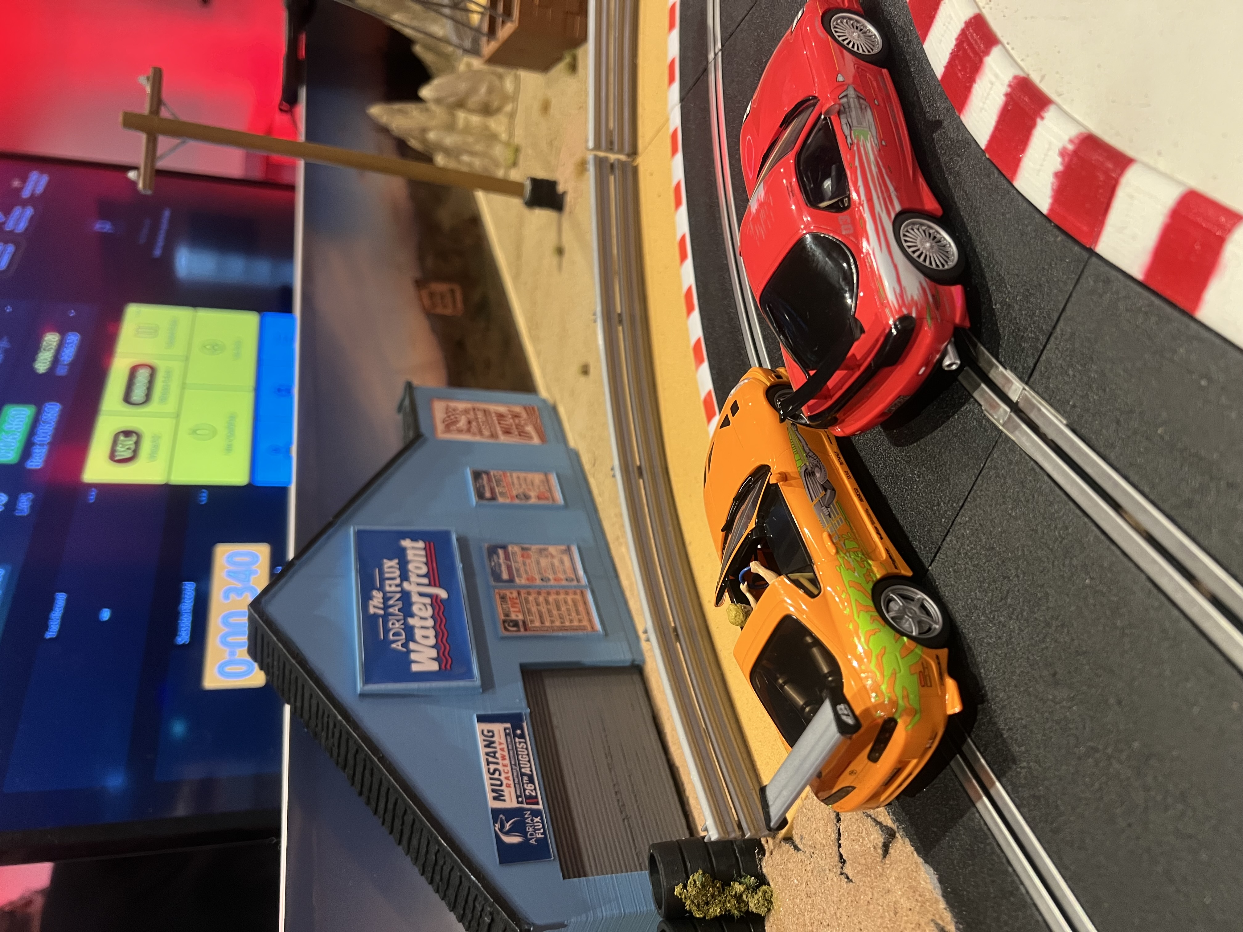 Bespoke Scalextric track with Adrian Flux branding at the Fluential influencer party at the Engine Rooms, London