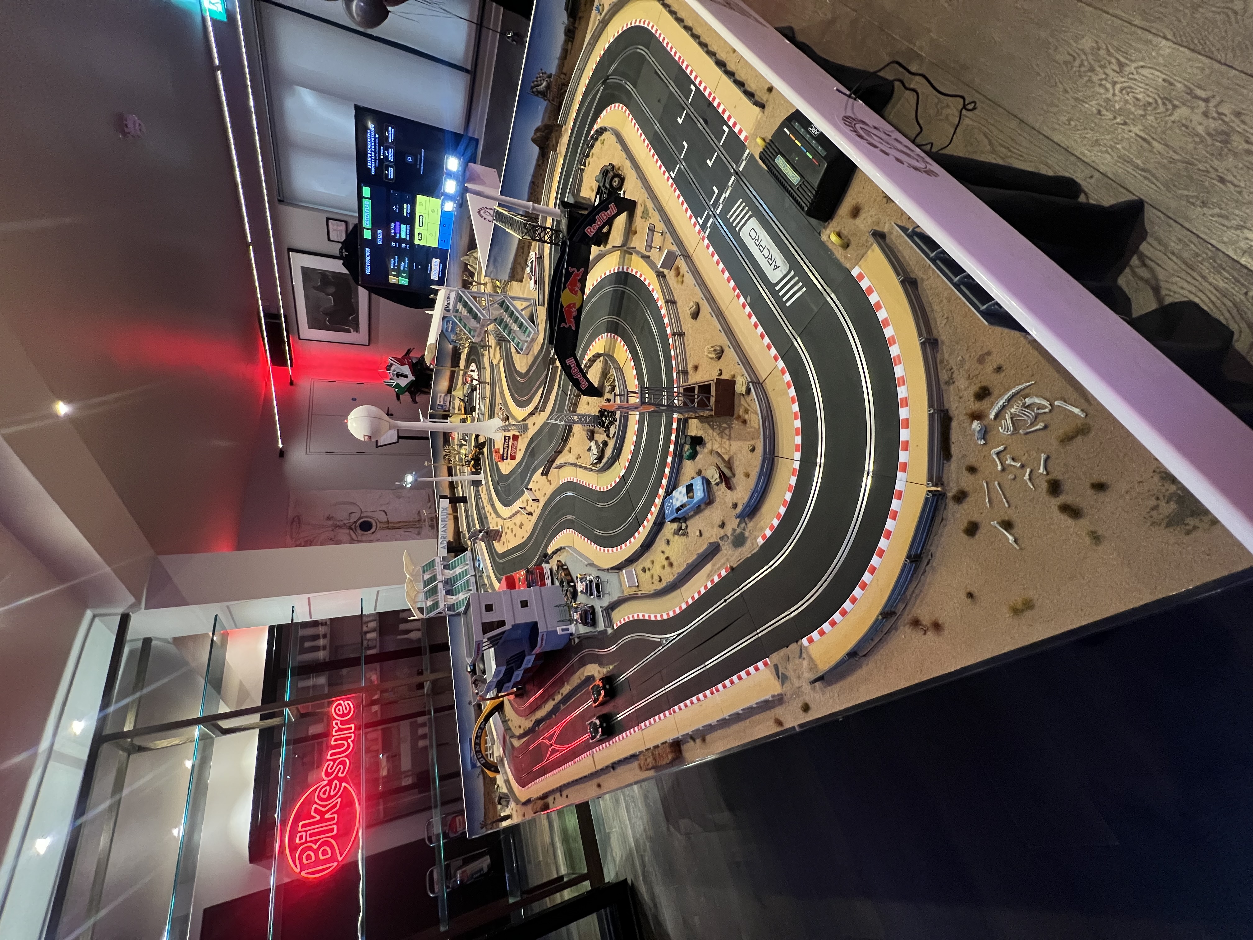 Bespoke Adrian Flux branded Scalextric circuit with custom scenery at the influencer party