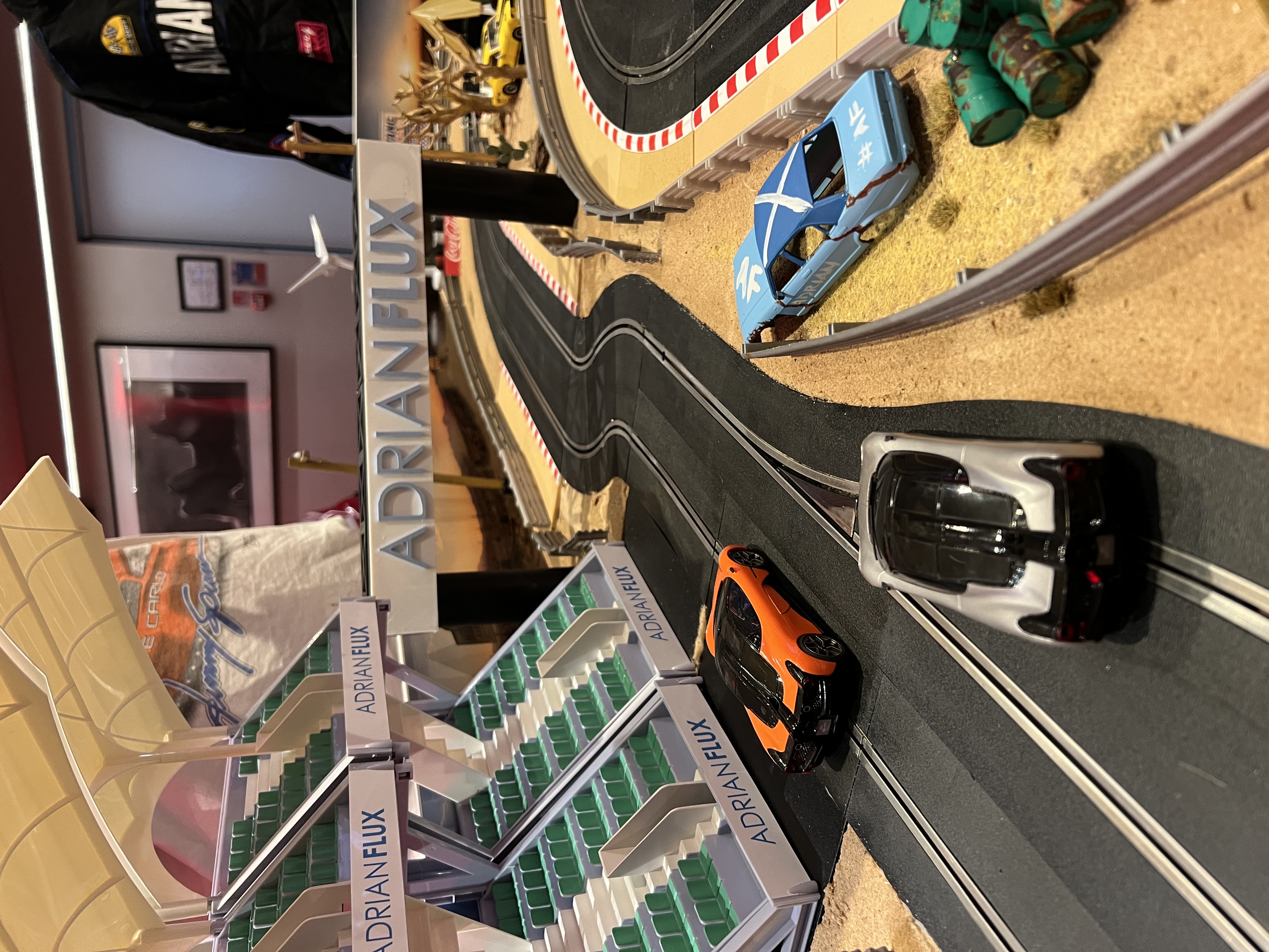 Adrian Flux branded Scalextric track with custom 3D scenery at the Engine Rooms influencer party