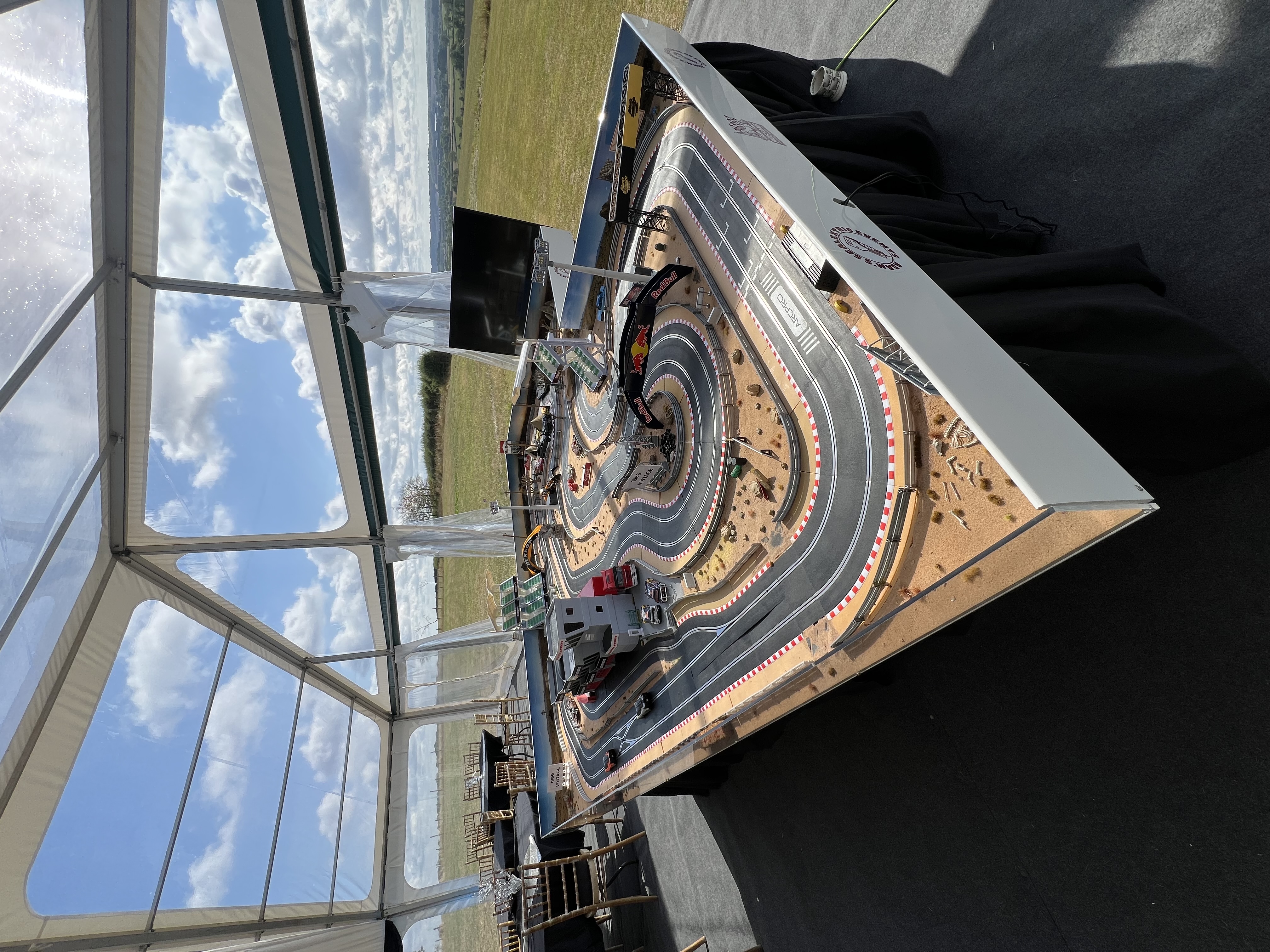 Fully themed giant Scalextric track set up inside a marquee for Robyn's 60th birthday party at her farm in Leicester