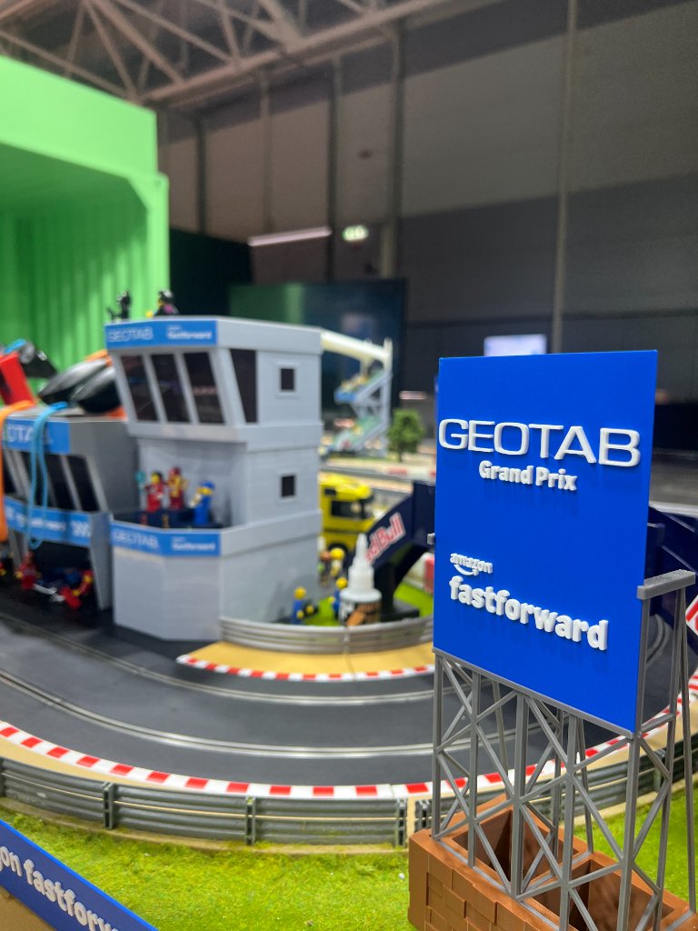 GEOTAB Grand Prix and Amazon Fastforward branded signage on the custom Scalextric racing circuit in Rome