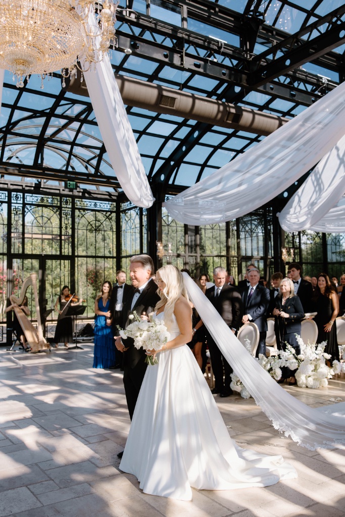 Pearlnote harp and violin duo performing during a wedding processional