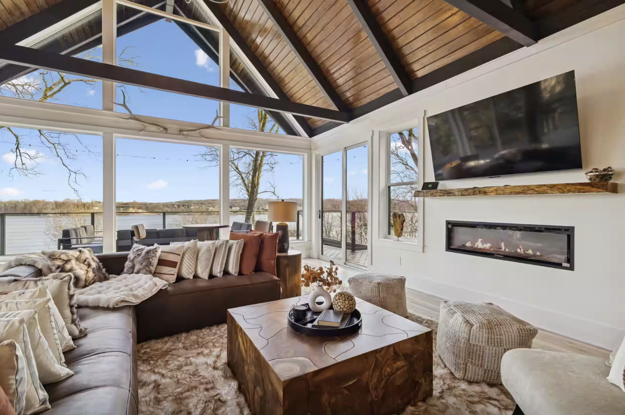 Great room with vaulted ceilings and lake views