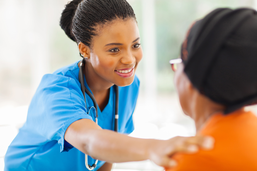 Dulla Care caregiver providing compassionate in-home support to a senior patient