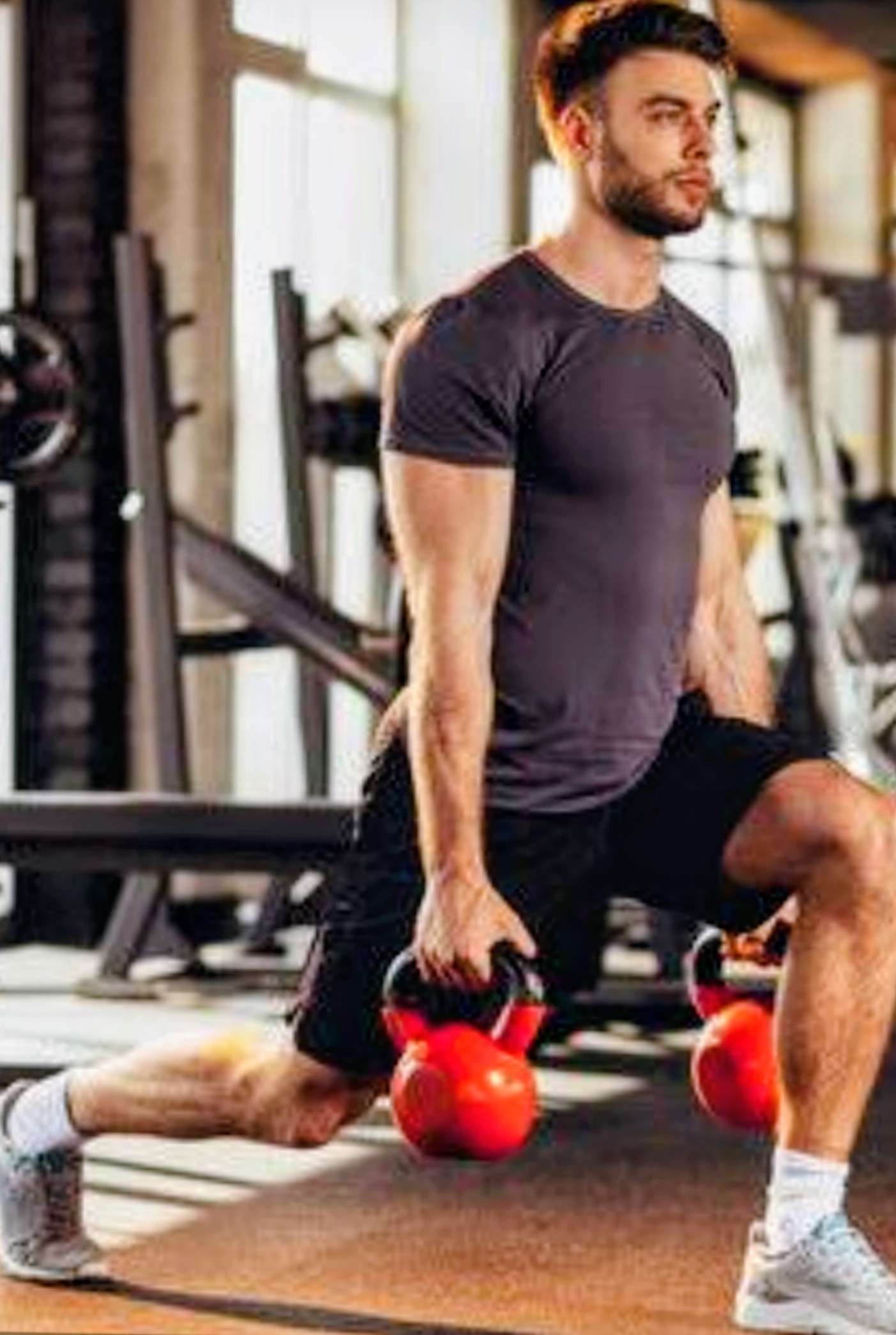 Athlete performing a kettlebell lunge
