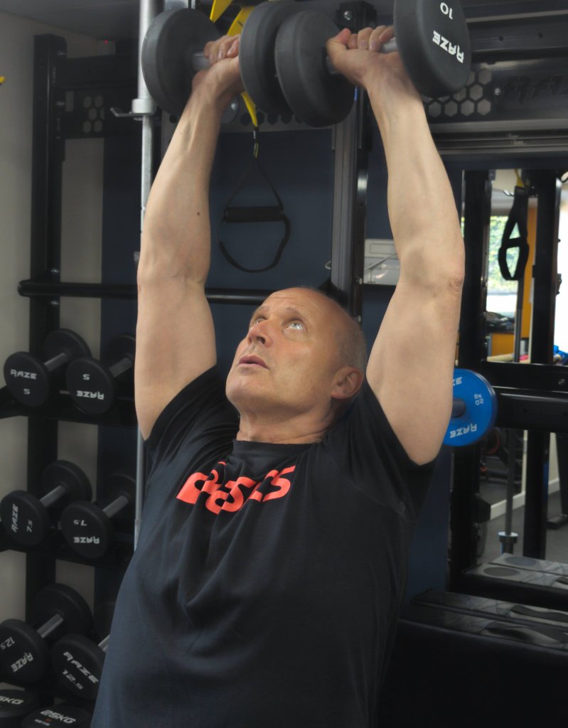 Personal trainer coaching a client