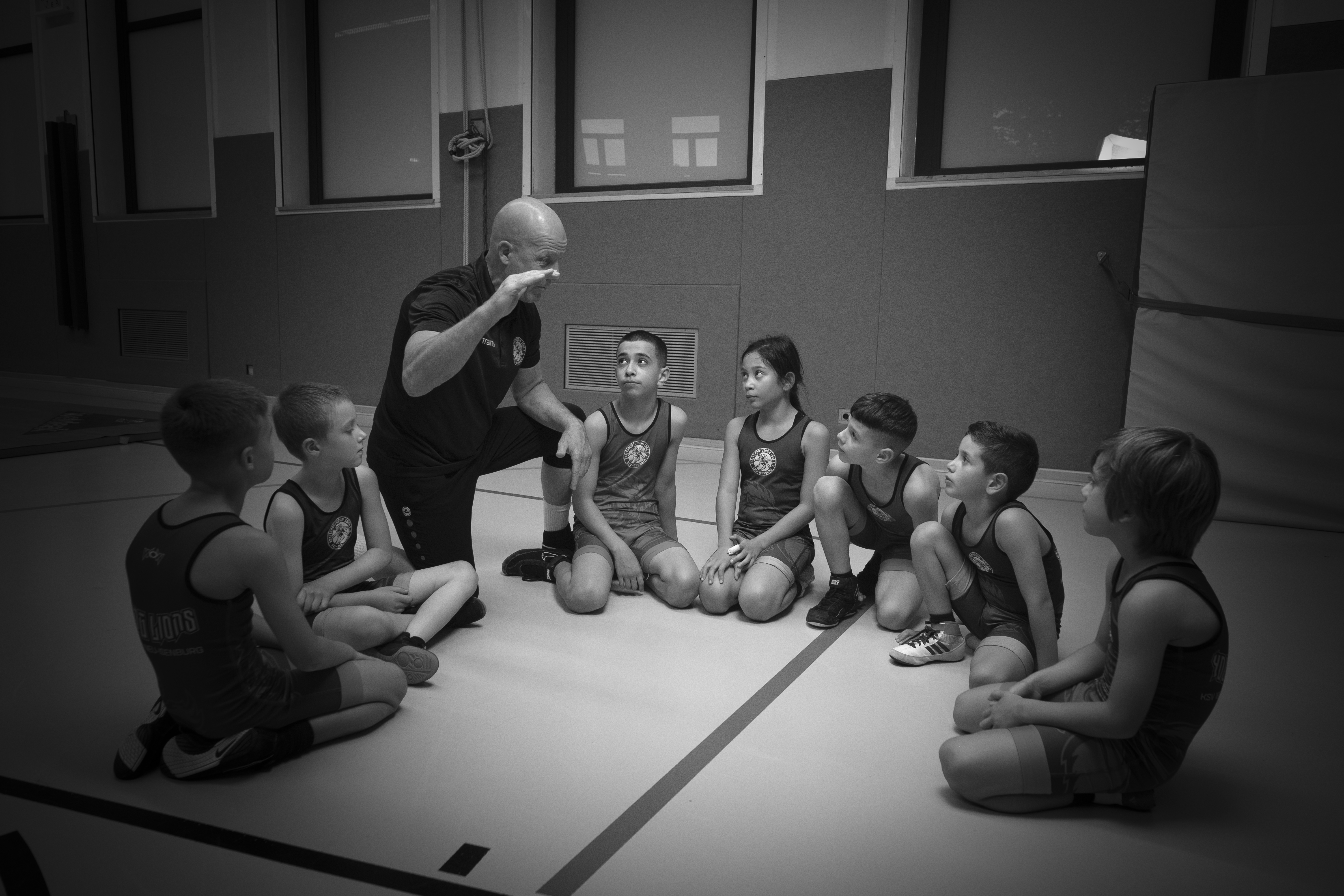 Coach speaking to young wrestlers
