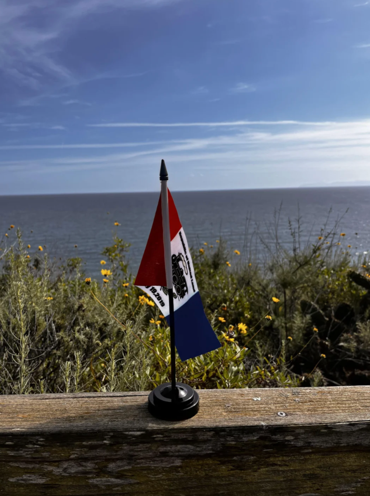 United Land Flag Amid the Sea