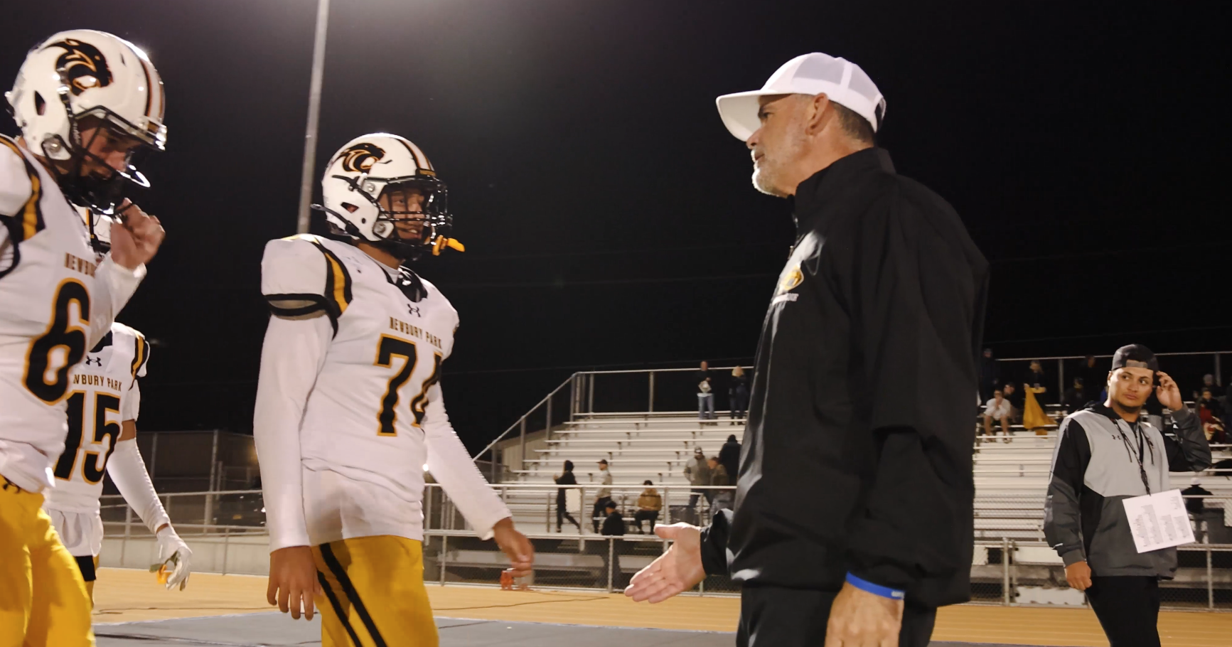 Charlie Smith coaching athletes on the field
