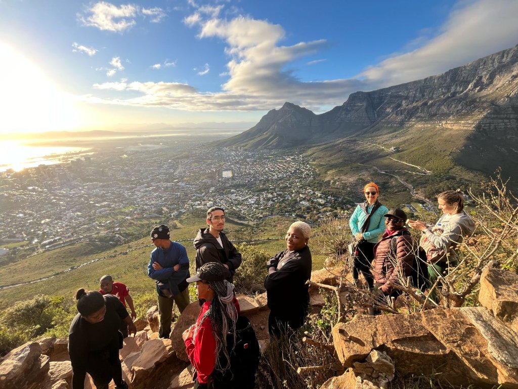 Group on mountain at sunrise