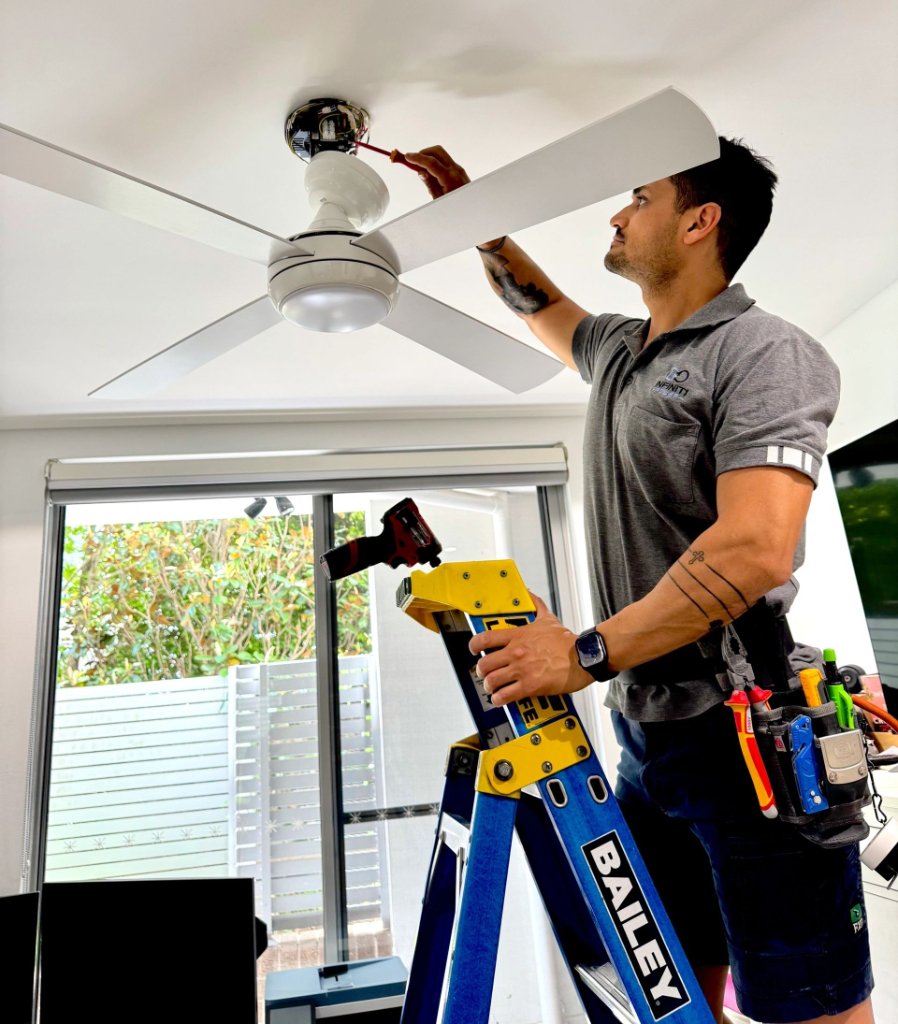 Licensed electrician installing ceiling fan Sydney