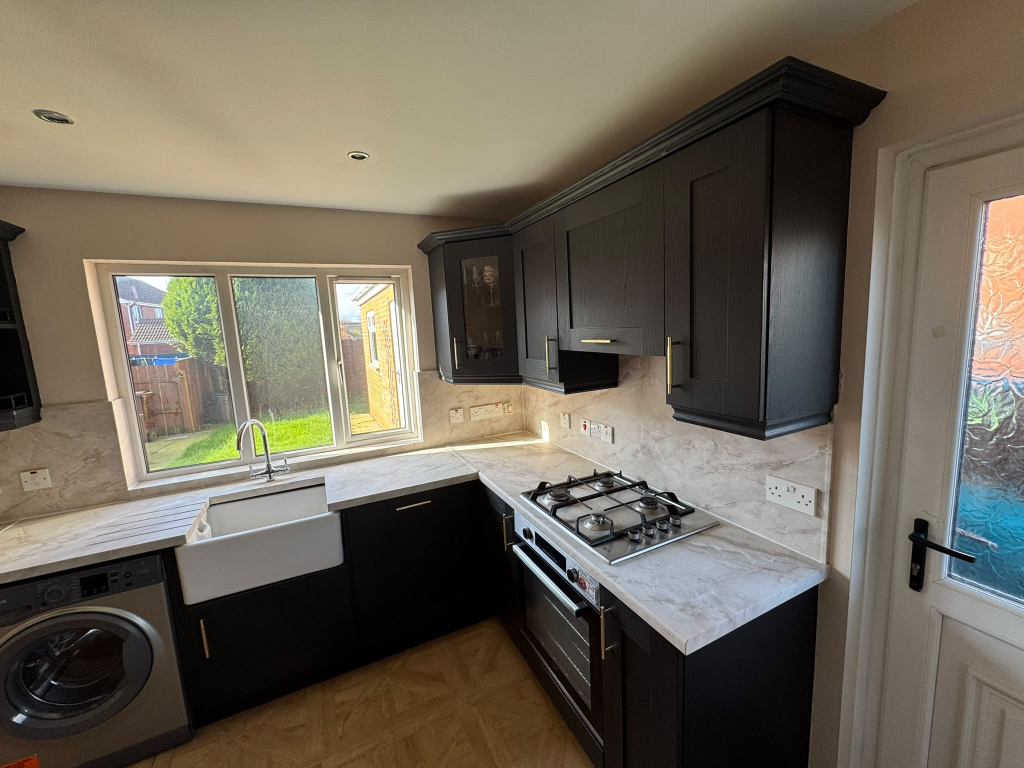 Same Newry kitchen refreshed with updated worktop and splashback vinyl wrap