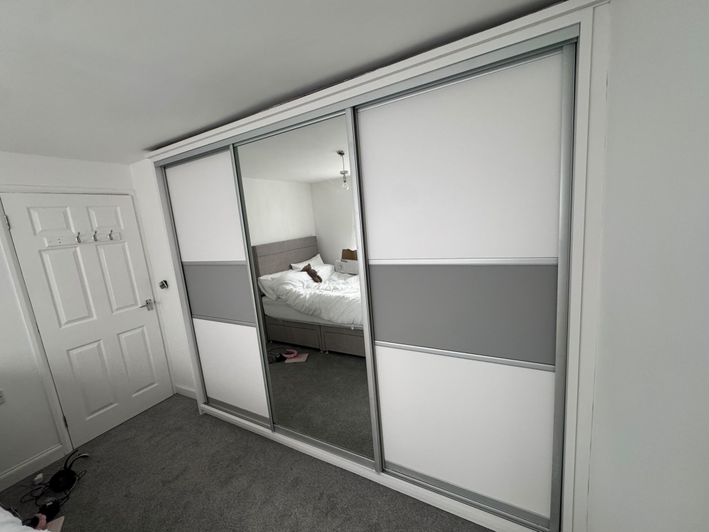 Same wardrobe transformed with white and grey vinyl wrap