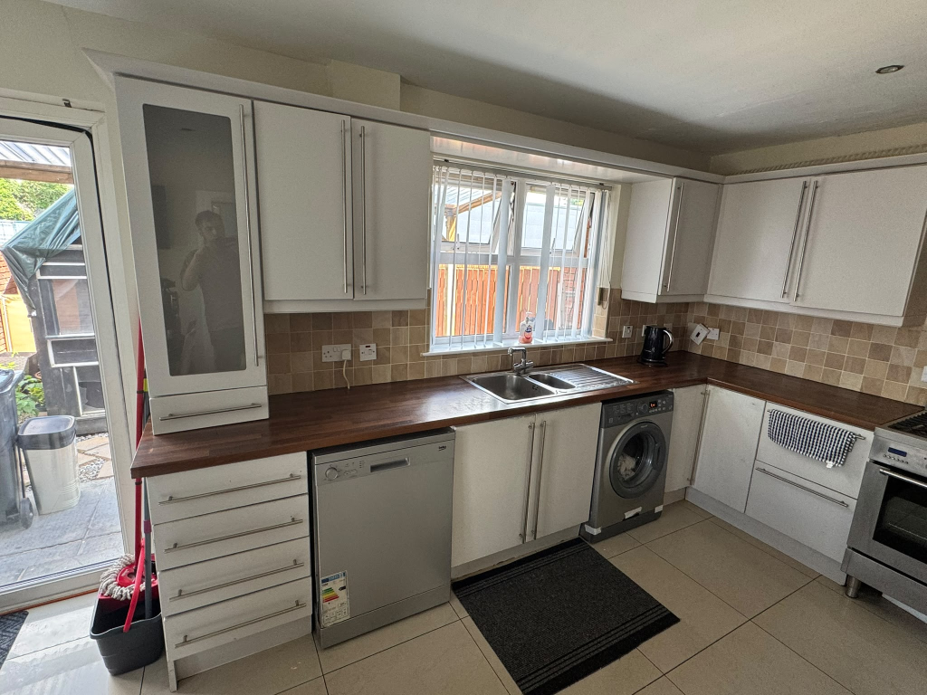 White shaker kitchen with dark walnut worktop before wrap