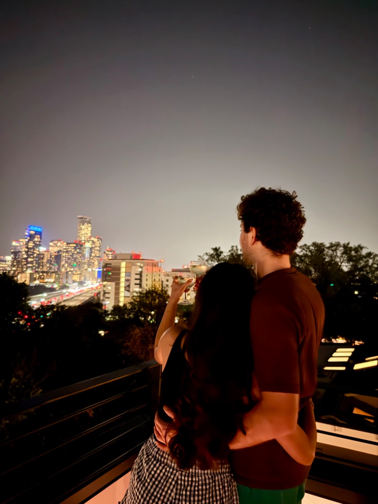 Couple on rooftop at night