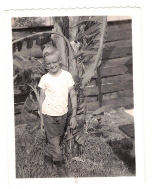 My father circa 1959 near Linhart Avenue in front of a banana tree