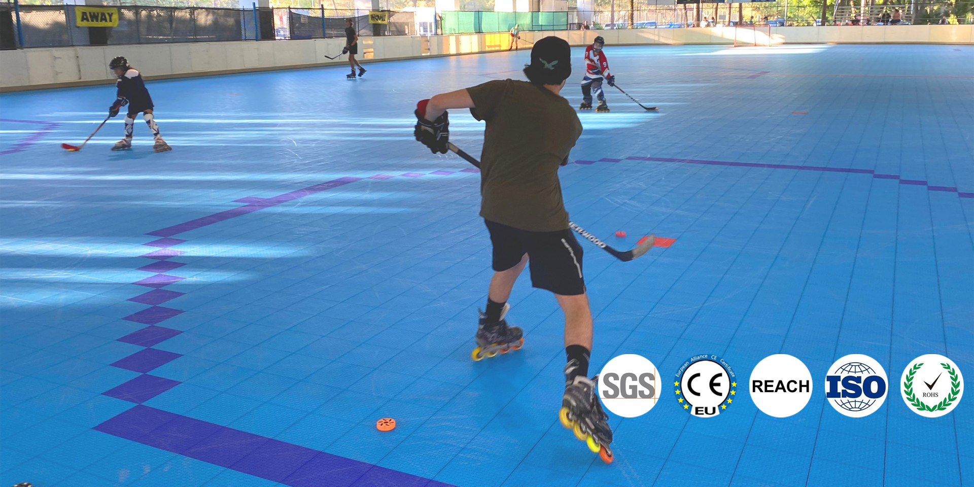 Roller hockey players on athletic tile court