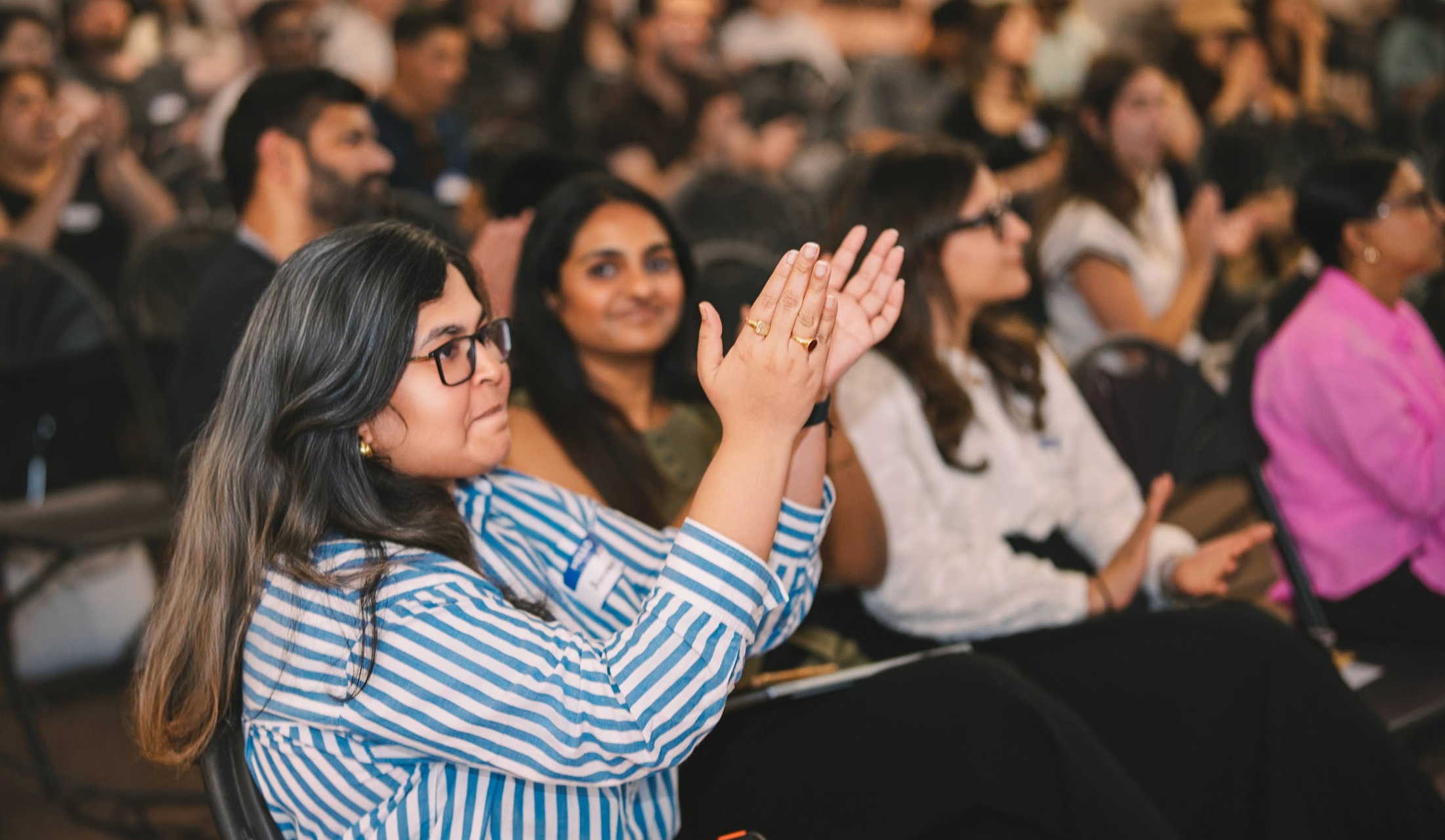 Audience applauding a speaker
